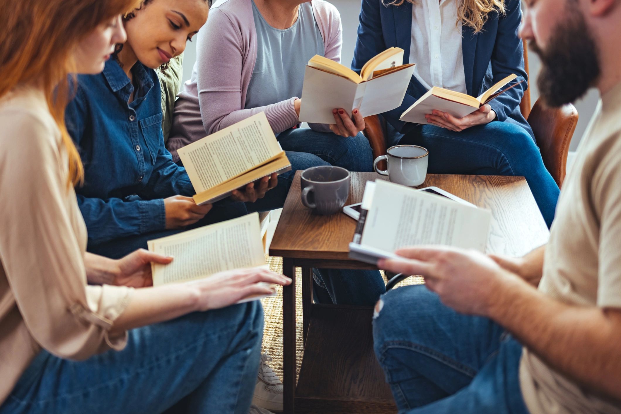 Reader discussing books at a table
