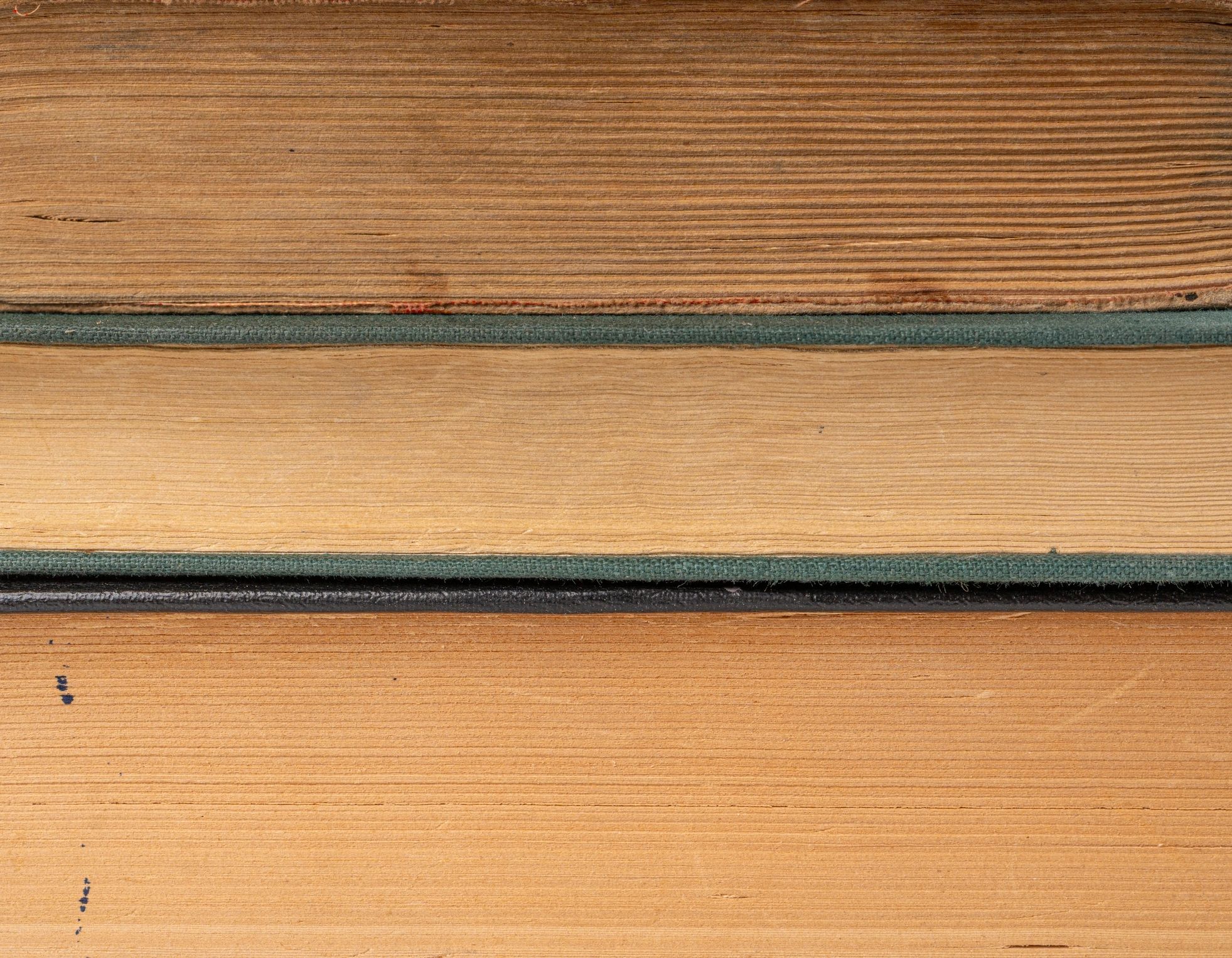 Close-up texture of vintage book pages stacked in a pile
