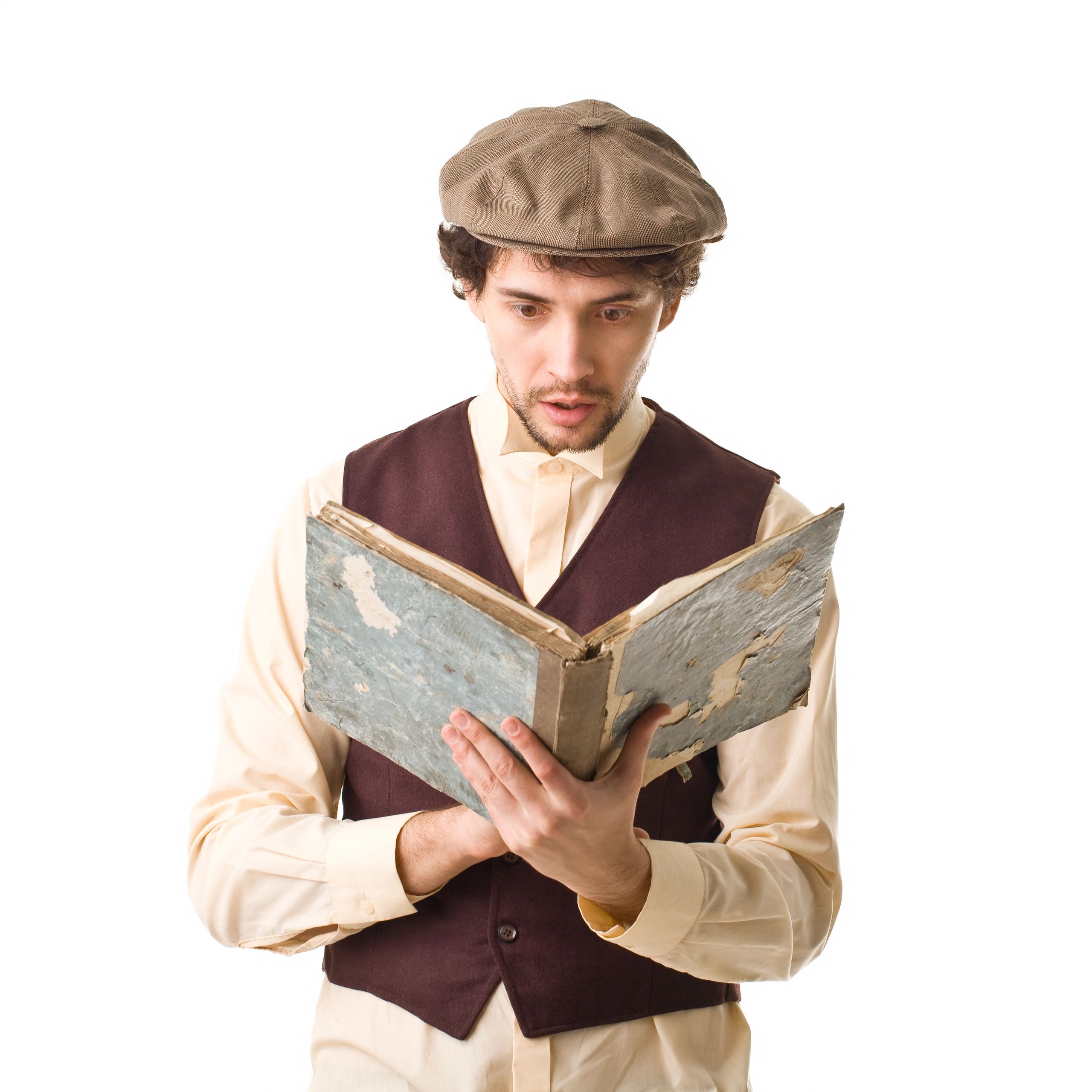 Portrait of a man holding an old book